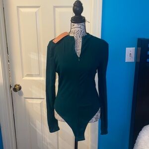 NWT.  Women’s zip up bodysuit